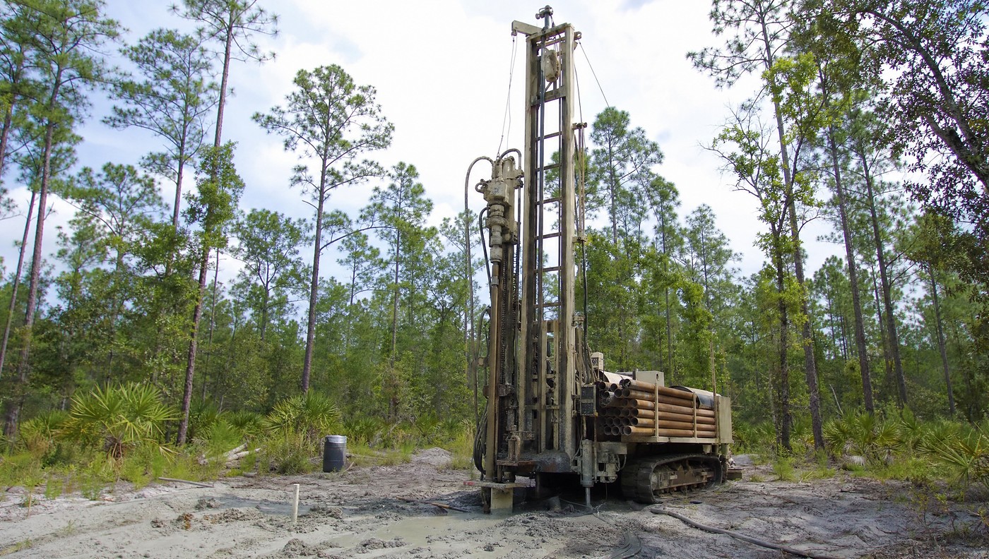 A water well drilling rig at work on a rural lot outside Jacksonville, Florida